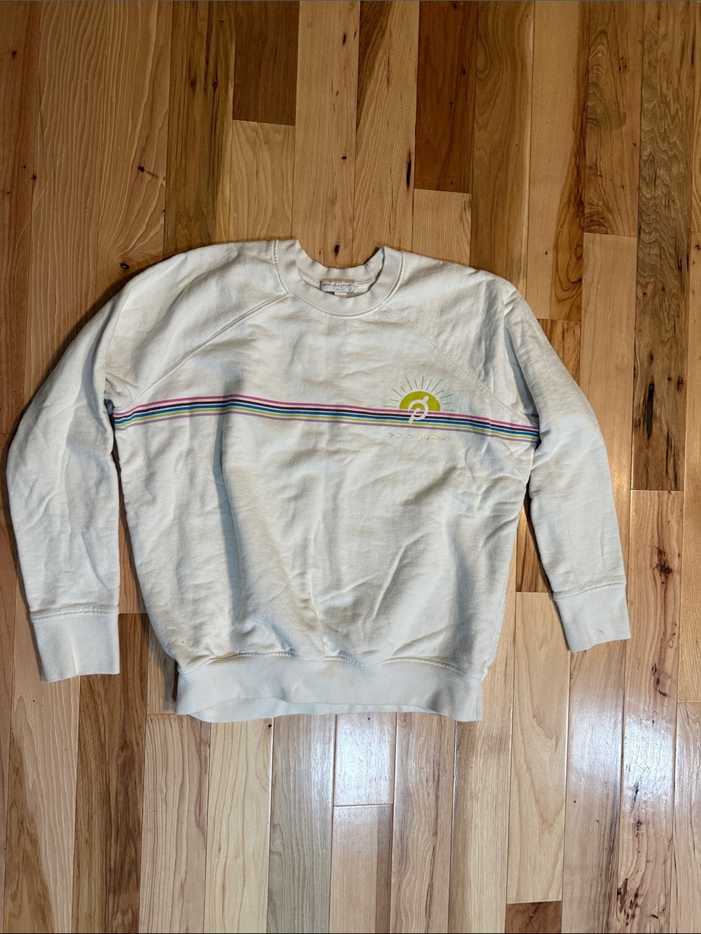 Spiritual Gangster Cream Pullover with Rainbow Chest Stripe and Yellow Sun